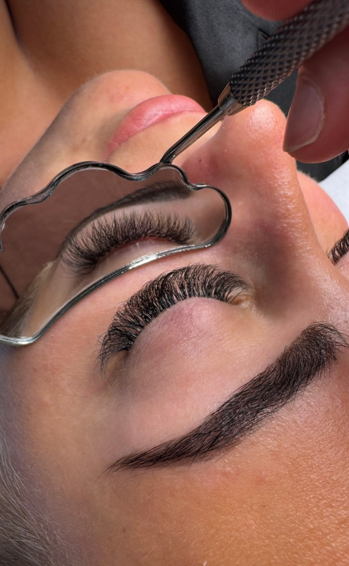 Volume lash application in progress